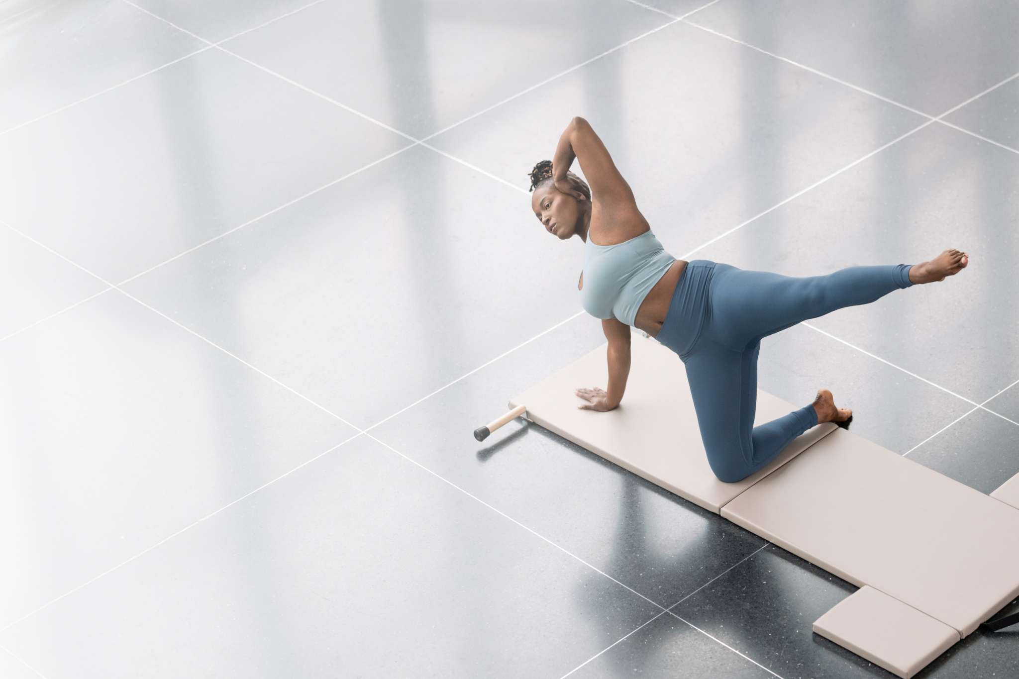 woman on contrology folding mat