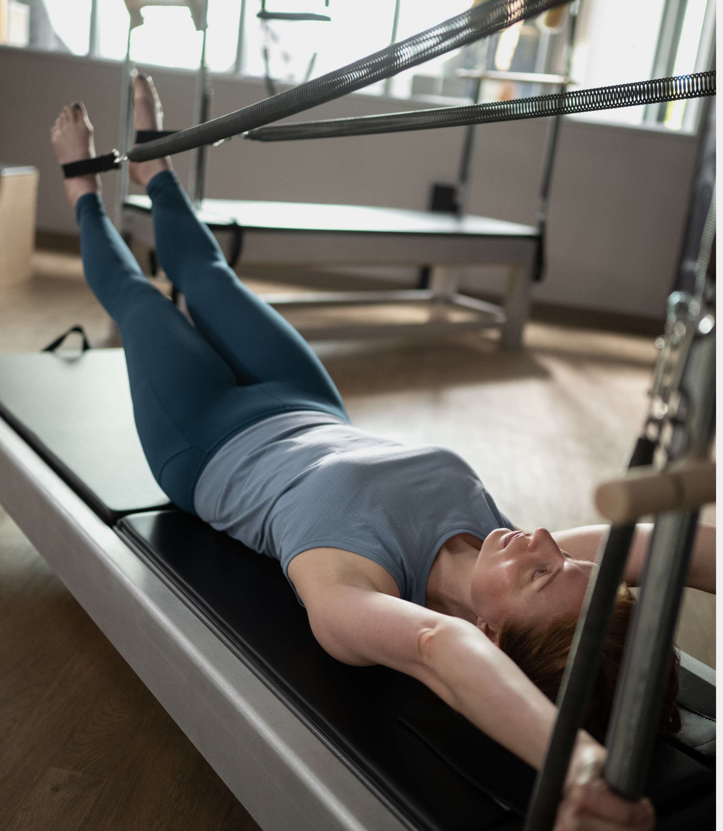 Contrology Reformer with Tower and Mat - in use
