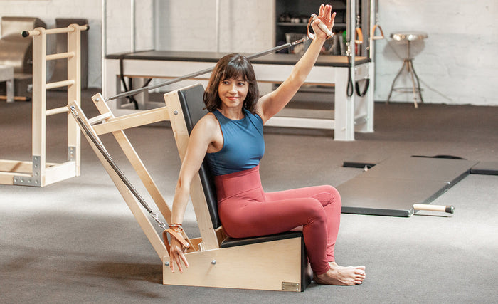 woman using contrology arm chair