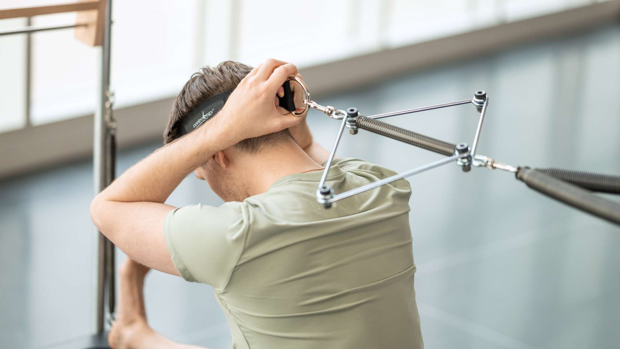 person using neck stretcher